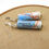 Thumbnail: Maui, Hawaii map earrings on a wood background.