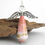 Thumbnail: Shades of pink ombre and gold paper bead angel ornament standing in front of a piece of driftwood.