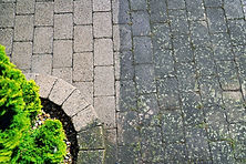 Difference between clean and dirty brick pavers.