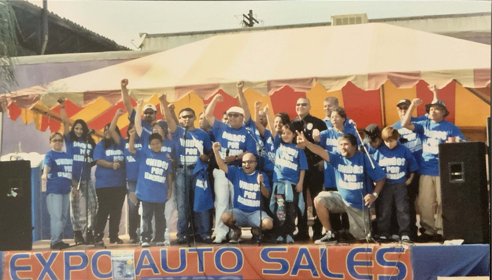 Group of individuals representing COMHPA at a speech.