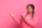 african-american-promoter-pointing-side-with-palm-while-advertising-product-studio-cheerfu