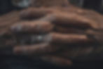 An eldery lady's hands clasped together