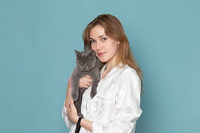 young-female-pajamas-holding-little-cute-grey-kitten-blue.jpg