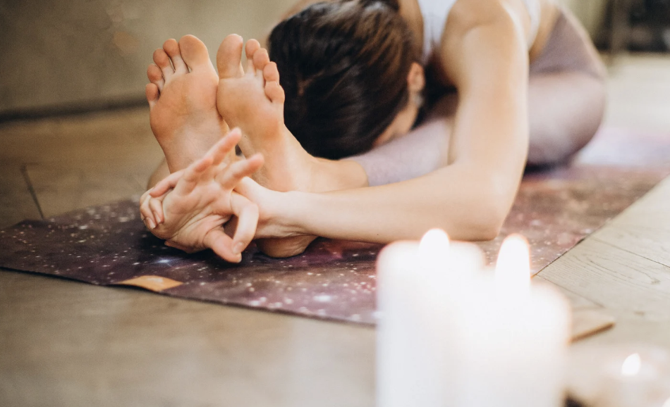 Couple enjoying a private candlelight yoga session