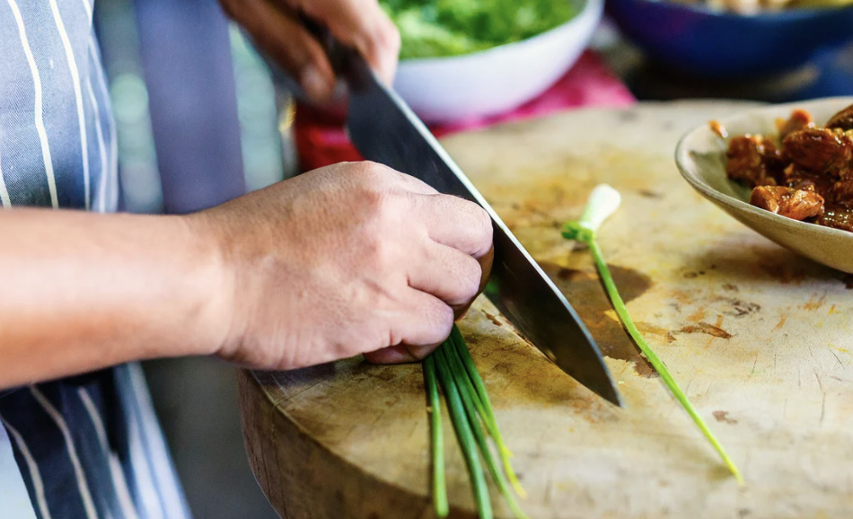 Couple taking a private cooking class with a Mirbeau chef