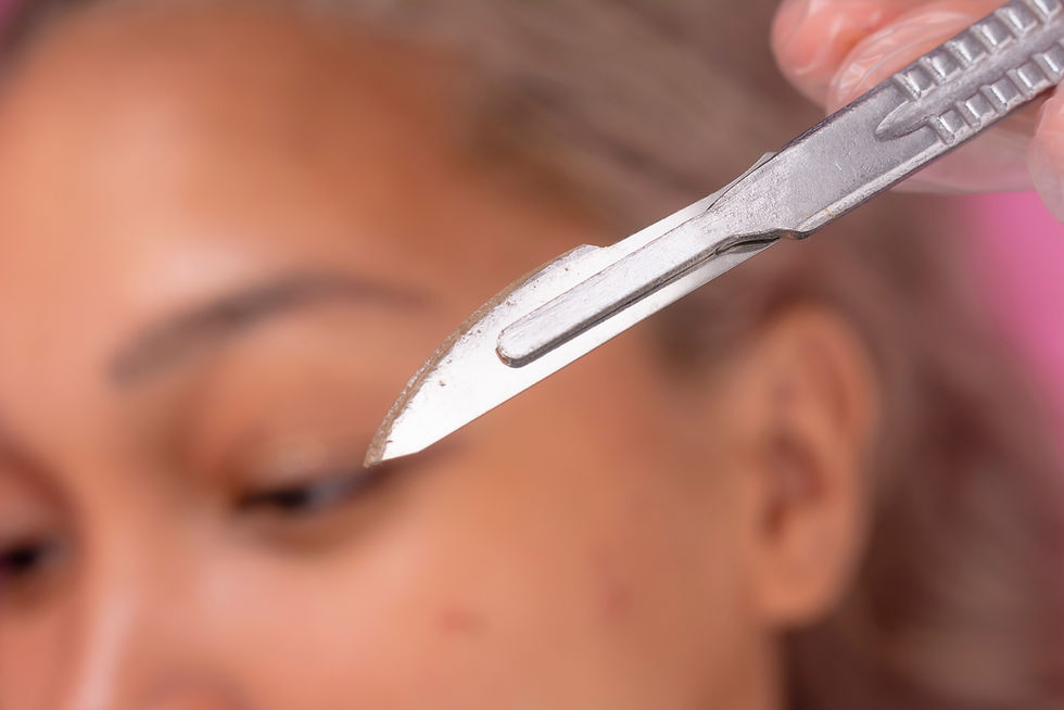 Close-up of a person dermaplaning face, blurred face in background, suggesting careful grooming.