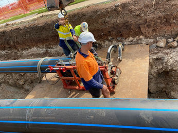 Maher Utilities Epping workers installing underground pipes.