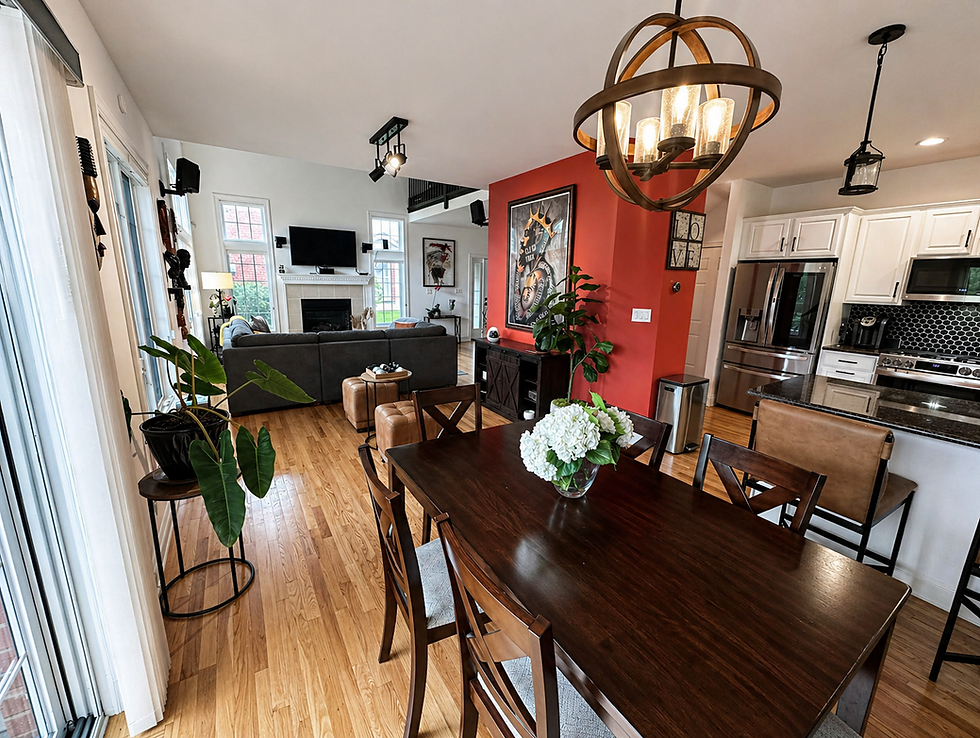 Staged open concept living, dining, and kitchen area