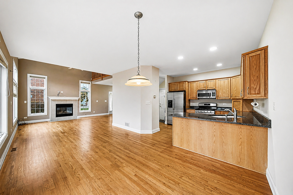 Open living room, kitchen, hardwood floors, fireplace for home staging