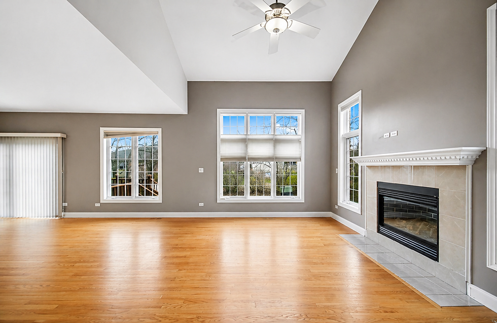 Living room with fireplace, wood floors, home staging support.