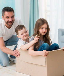 family playing with cardboard box