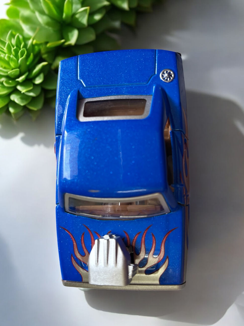 Blue toy car with flames