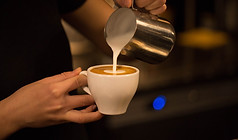 Barista Pouring Milk
