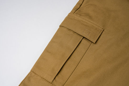 Close up view of cargo pocket on khaki pants