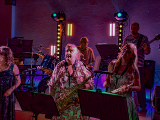 Band and sax wedding act performing at a barn wedding in the UK