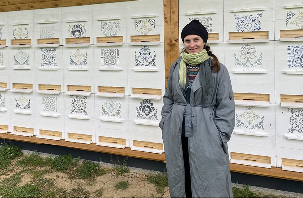 Marta Panco of Azaka Consulting visiting traditional beehives in Slovenia.