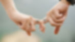 Holding hands with matching tattoos