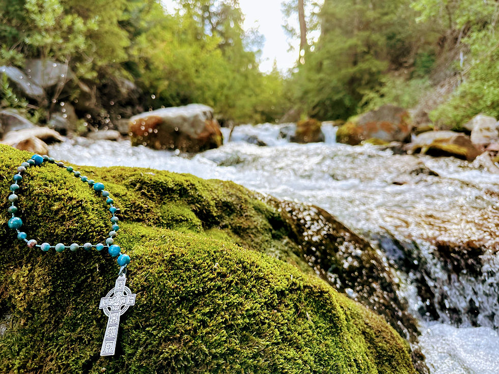 Celtic rosary on moss in the river