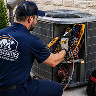 HVAC technician repairing air conditioning unit in New Braunfels Texas