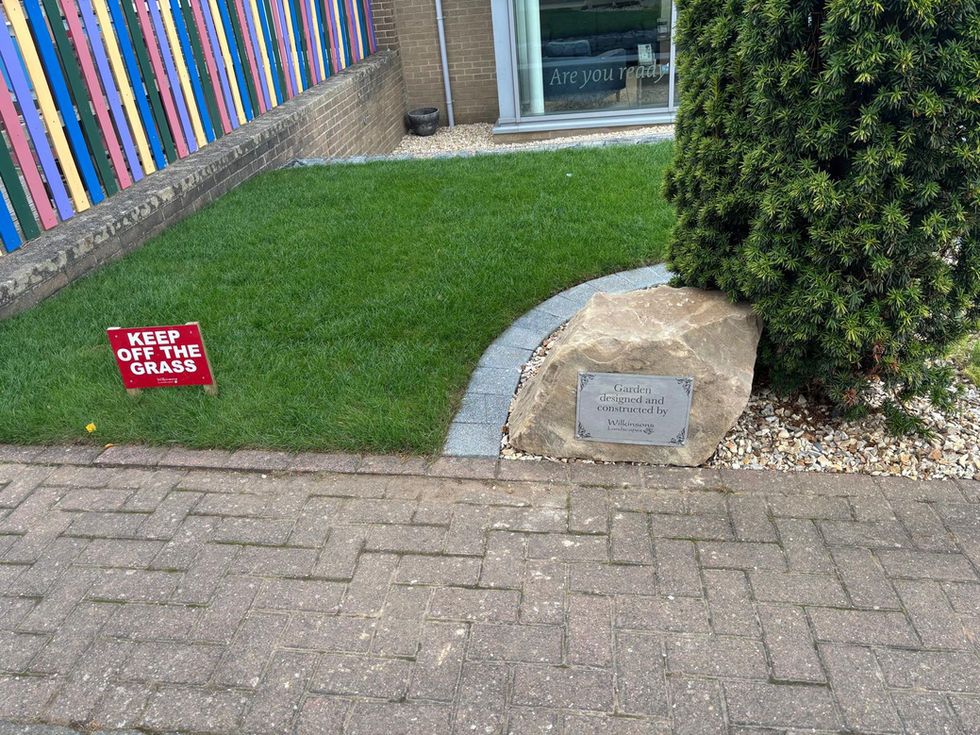 Fresh turfing and installation sign stone at Teesside High School
