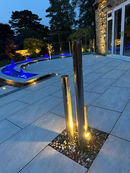 Illuminated water feature on patio, with garden design. Wilkinsons Landscapes, garden designers near me