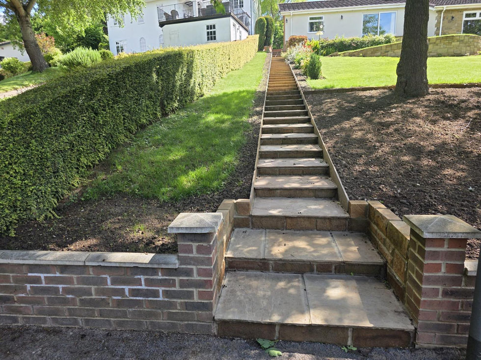 Natural stone entrance steps constructed to complement the property’s existing stone façade.