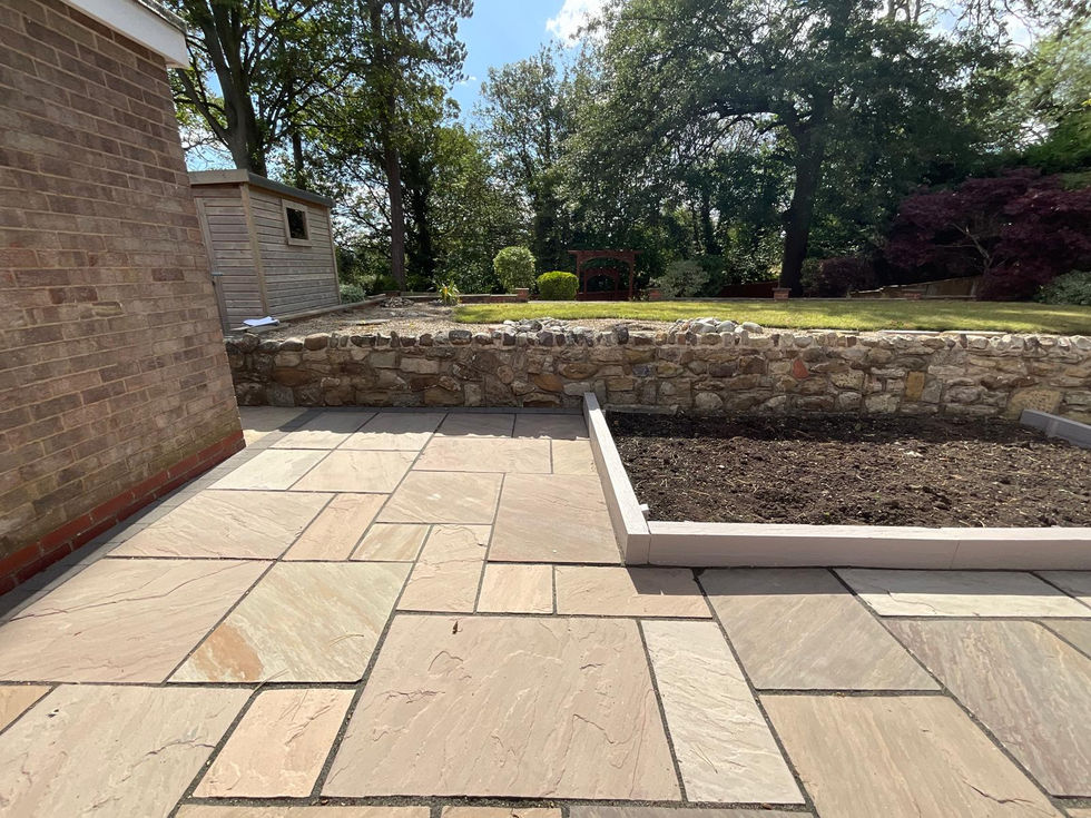 Newly laid patio and raised planting area