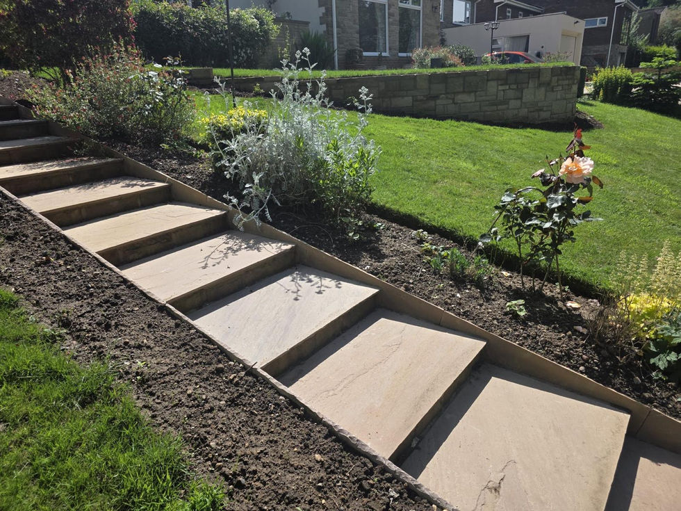 Natural stone entrance steps constructed to complement the property’s existing stone façade.