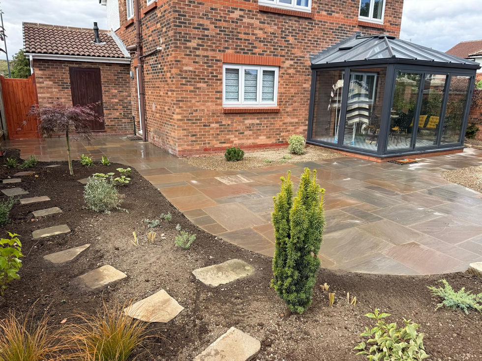 Newly landscaped rear garden with Indian sandstone paving