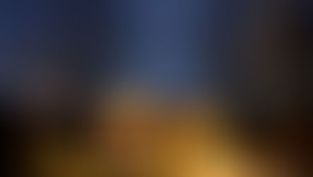 Warm lighting illuminating a wooden pergola at night, creating a glowing focal point in a landscaped garden beneath a clear moonlit sky.