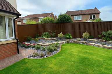 Beautiful landscaped garden with lawn, flowers, and fence. Wilkinsons Landscapes