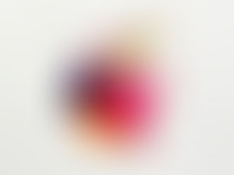 Colorful paint splatters with gold, red, pink, purple, and orange hues on a white background, evoking a vibrant, dynamic mood.