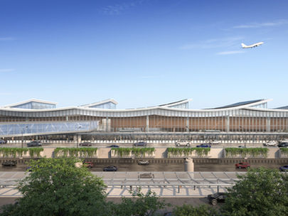The Cleveland airport redesign during the day. The airport features a modern exterior with large windows to the inside. Trees line roads and a bridge connects over the arrival roads to the planned parking garage and ground transport center