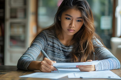 Asian Woman Completing Financial Aid_edited.jpg