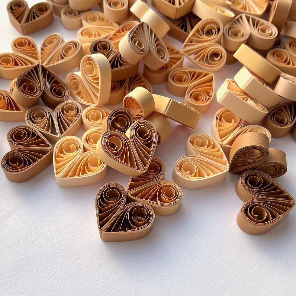 Little brown and beige quilled paper heart ornaments for rustic and natural wedding decor