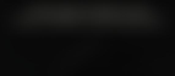 A grand piano on a black background