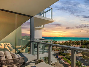 view from balcony looking over the ocean at W hotel in South Beach Miami at sunset