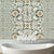 Botanical ceramic tile with green grey vines and ivory flowers