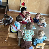 teacher on the table with kids