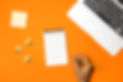 top-view-workspace-with-orange-background.jpg