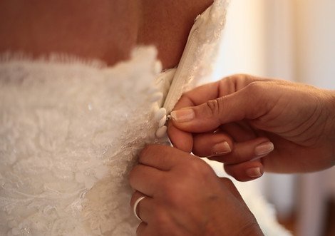 Putting on the wedding dress
