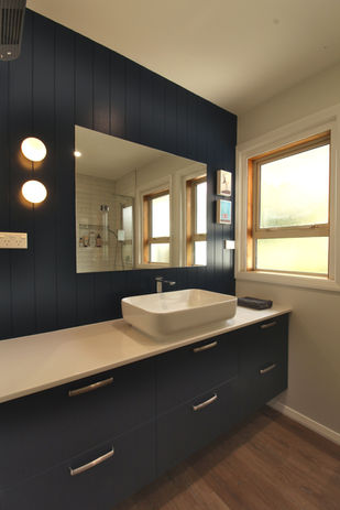 Freshly renovated bathroom with modern fixtures, sleek cabinetry, and a clean, contemporary design.
