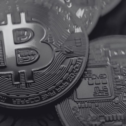 Monochrome close-up of a Bitcoin coin, representing crypto’s role in bankruptcy claims trading.