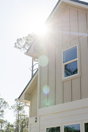 exterior of home with sun shining in corner