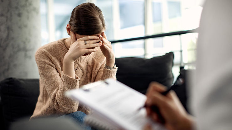Person experiencing the effects of vicarious trauma after repeated exposure to others' traumatic experiences