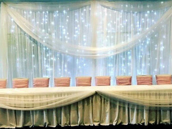 Fabric and fairy lights backdrop