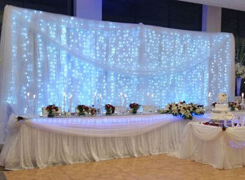 Fairy lights and fabric backdrop