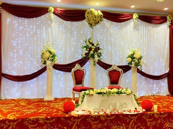 Burgundy and white backdrop with lights