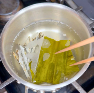 Making miso soup dashi with kombu and niboshi