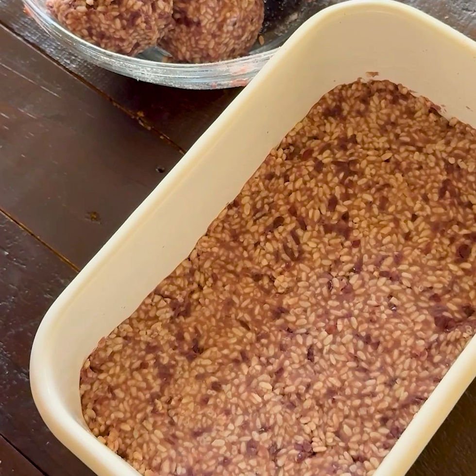 Rectangular dish with azuki miso mixture on wooden table. Warm, rustic setting.